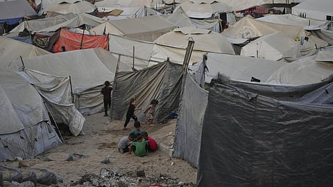 Children play at a tent camp for displaced Palestinians in Gaza City