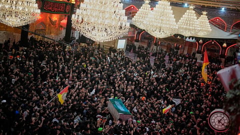 The coffin of the late Iranian Supreme Leader Ayatollah Ali Khamenei is carried through a crowd of mourners at the Imam Hussein Shrine in Karbala, Iraq.