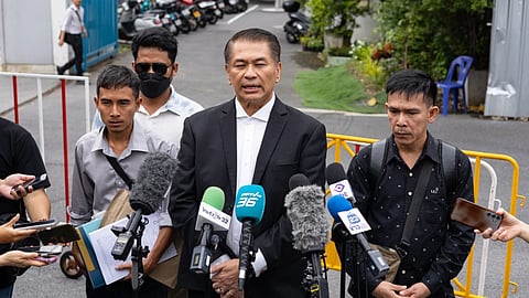 Lawyer Kunpat Singhathong and three sailors from the Thailand-flagged ship, the Mayuree Naree, speak to journalists outside the Central Labour Court in Bangkok, Thailand.