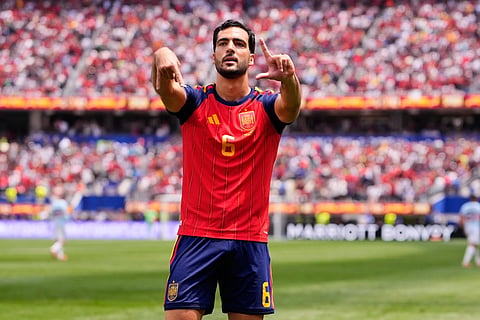 Spain's Mikel Merino (6) scores his side's second goal as Belgium goalkeeper Senne Lammens (in yellow) tries to stop it Friday during the World Cup quarterfinals.