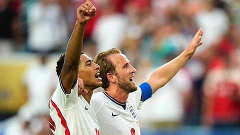 Jude Bellingham, left, and Harry Kane celebrates England's victory over Norway in a World Cup quarterfinal soccer match in Miami Gardens