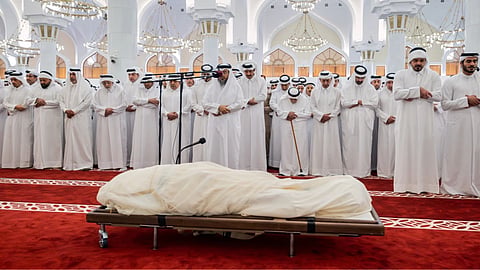 In this picture released by the Qatar Amiri Diwan media office, mourners pray over the body of Qatar’s former ruler, Sheikh Hamad bin Khalifa Al Thani, at the Mohammed bin Abdulwahab Mosque in Doha, Qatar.