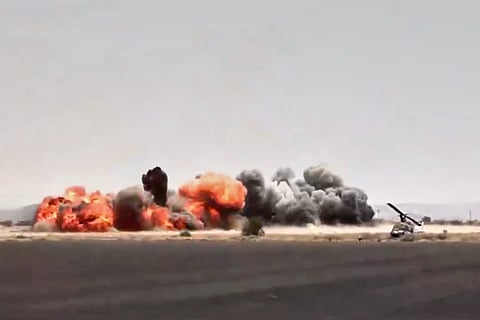 This image taken from video broadcast by Al-Masirah TV, a Houthi-controlled news channel, shows an explosion at the Sanaa International Airport compound during what the Iranian-backed Houthi rebels in Yemen said were several Saudi airstrikes in Sanaa, Yemen, Monday 