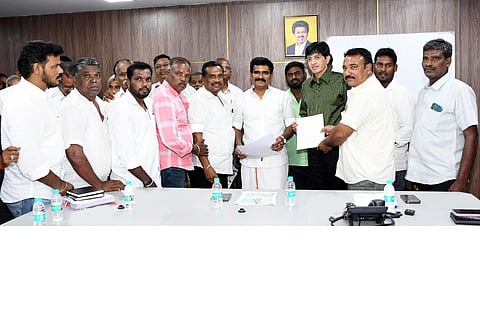 State Minister R Nirmalkumar receives a petition from the fishermen association representatives on Tuesday
