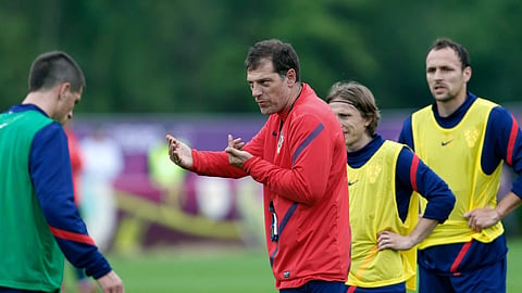 The then-Croatia's head coach Slaven Bilic talks to his players during a training session of Croatia at the Euro 2012 soccer championship in Warka, Poland