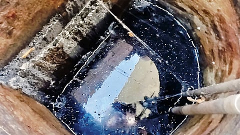 Grey water discharged from a low-lying tract of land behind VGN Nagar mixes with the well water in Iyyappanthangal