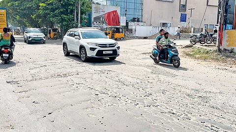 Loose gravel and uneven surface of the road put motorists at risk of accidents