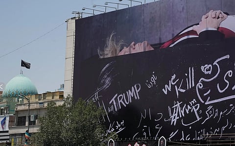  A billboard depicting U.S. President Donald Trump lying on what appears to be a coffin and bearing anti-Trump messages, including the phrase “We Kill Trump,” is seen at Islamic Revolution Square in downtown Tehran, Iran, Wednesday, July 15, 2026.