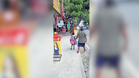 A shop alongside Brindavan Nagar Main Road with steel
bars fixed across the path blocks pedestrians.