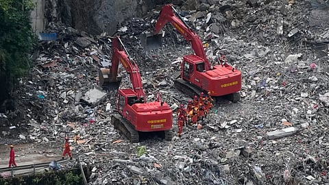  Rescuers work at the site of a landslide in Pengshui County in southwestern China’s Chongqing.