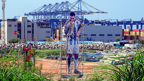 Thiruvananthapuram: A towering cutout of Argentine footballer Lionel Messi stands near the Vizhinjam International Seaport ahead of the FIFA World Cup 2026 final match, in Thiruvananthapuram, Kerala, Sunday, July 19, 2026. 