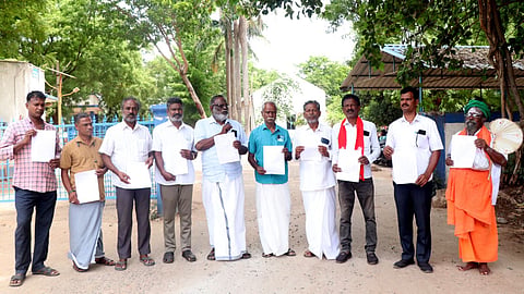 Makkal Iyakkam representatives in front of the Aavin office with petitions in Thanjavur on Monday

