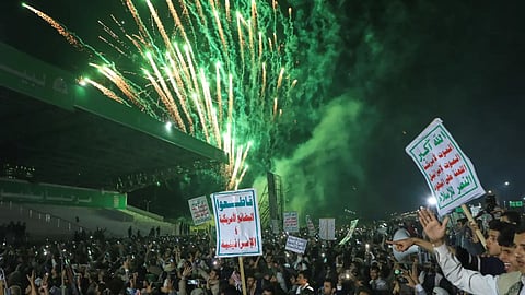 Fireworks burst as Houthi supporters rally against the Saudi-led coalition in Sanaa, Yemen, Monday, July 20, 2026. Placards in Arabic read: “God is great, Death to America, Death to Israel, A curse on the Jews and Victory to Islam” and “boycott American and Israeli goods”.
