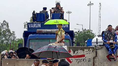 Security personnel remain deployed with anti-riot vehicles at the Shambhu Border as farmers from various organisations continue their 'Delhi Chalo' protest against the proposed India-US trade deal, in Ambala district, Haryana