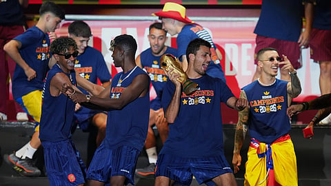Players from Spain's national soccer team perform for fans at Cibeles Square in Madrid.
