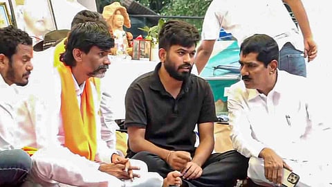 Maratha activist Manoj Jarange meets Cockroach Janata Party founder (CJP) Abhijeet Dipke as the former visits Jantar Mantar during a protest demanding the resignation of Union Education Minister Dharmendra Pradhan over alleged irregularities in the NEET examination, in New Delhi, Wednesday, July 22, 2026.