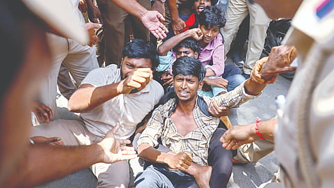 Police detain SFI, DYFI during a protest near Rajarathinam Stadium in Egmore on Wednesday