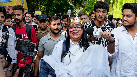 Cockroach Janta Party (CJP) supporters hold a protest demanding the resignation of Union Education Minister Dharmendra Pradhan over NEET paper leak issue, in New Delhi, Thursday, July 23, 2026. 