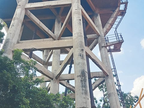 The crumbling concrete pillars of the overhead tank in a neighbourhood in Vyasarpadi