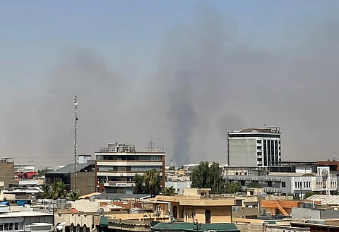   Black smoke rises following explosions near a military base hosting U.S. forces in the northern Iraqi city of Irbil, Friday, July 24, 2026.