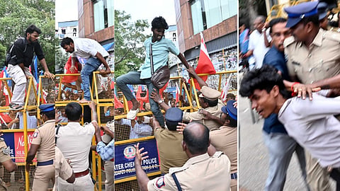 Cops stopping students from Left unions from breaching barricades in their bid to reach the Lok Bhavan on Sunday