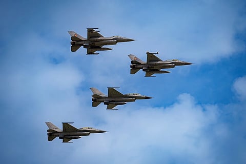 F16 fighter jets of the Romanian Air Force and the Romania based European F-16 Training Center (EFTC), perform a fly-by at the Black Sea, Defense, Aerospace and Security (BSDA) international exhibition in Bucharest, Romania, Wednesday, May 22, 2024.