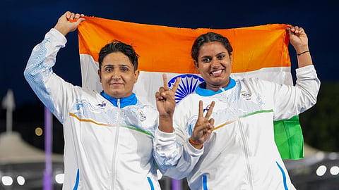 India's Sharmila Dhankar, left, and Shilpa K Shyla celebrate after winning gold and bronze medals respectively in the women's shot put F57 at the 23rd Commonwealth Games, in Glasgow, Scotland, Monday.