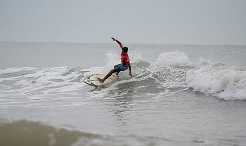 One of the competitor in action during the surfing competition at Mahabalipuram on Thursday