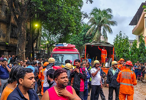 Rescue personnel and other officials at a four-storey building collapsed at Bhiwandi