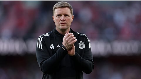 Newcastle's head coach Eddie Howe applauds to supporters at the end the English Premier League soccer match between Arsenal and Newcastle United in London.