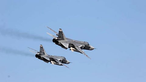 Photo provided by the U.S. Navy, two Russian Sukhoi Su-24 attack aircraft fly near USS Donald Cook in the Baltic Sea.