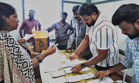 Census enumerators collect their enumeration kits from the Greater Chennai Corporation Zonal Office in Sholinganallur