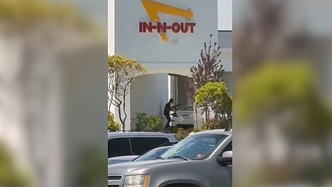 This still image captured from video by a witness shows the scene of a shooting that started at an In-N-Out Burger restaurant, Saturday, Aug. 1, 2026 in Twin Falls, Idaho.