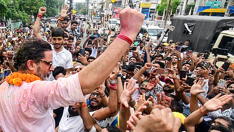 Jan Suraaj Party chief Prashant Kishor celebrates with supporters after taking the lead in the Bankipur Assembly by-election during the counting of votes, in Patna, Monday, Aug. 3, 2026 