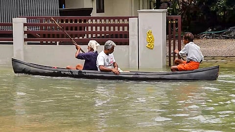 People using boats due to excessive waterlogging in Kerala.