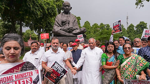 Leader of Opposition (LoP) in Lok Sabha Rahul Gandhi, Samajwadi Party (SP) MP Ram Gopal Yadav, Congress MP Pramod Tiwari and other opposition members stage a protest demanding Home Minister Amit Shah's statement on alleged police excesses against students, discussion on "misappropriation" of Ram temple donations and statehood for Jammu and Kashmir, during the Monsoon session of Parliament, at the Mahatma Gandhi statue, in New Delhi