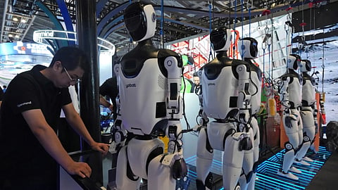 A worker standing next to Humanoids 