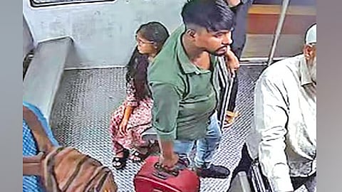 A scene of a young man from Odisha carrying a suitcase containing the body of a woman on a Chennai suburban train