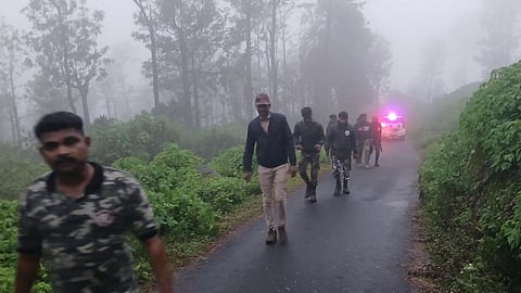 Forest personnel involved in tiger tracking operation braving heavy mist in the Nilgiris.