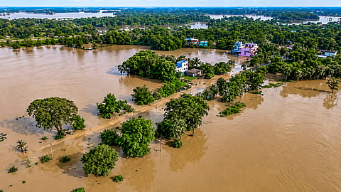  Bhadrak: People wade through floodwater on an inundated road following rainfall as water from the Salandi river enters villages, in Bhadrak district, Odisha, Monday, Aug. 17, 2026