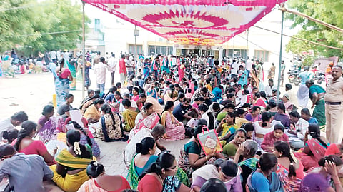 Nearly 5,000 people, largely women, gathered at a marriage hall in Melur town, demanding police action against the scammers