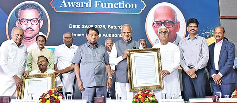 Former Governor Banwarilal Purohit conferring the Era Sezhiyan award on ex-CM Manik Sarkar
