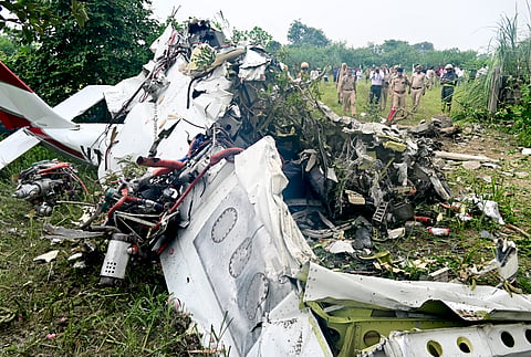  Kanpur: People gather near the wreckage of a four-seater, dual-engine Tecnam aircraft which crashed yesterday in a fatal crash on the outskirts of the Natthapurwa village near the Ganga Barrage, in Kanpur, Uttar Pradesh, Friday, Aug. 28, 2026. Flight instructor Sachin Bhatia and trainee pilot Abhishek Pujari died when the aircraft crashed shortly after taking off from the Garg Aviation Training Center.