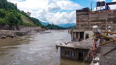A view of destroyed buildings near a waterbody in the aftermath of devastating flash floods, at Devighat, in Nuwakot district, Nepal, Monday, Aug. 31, 2026