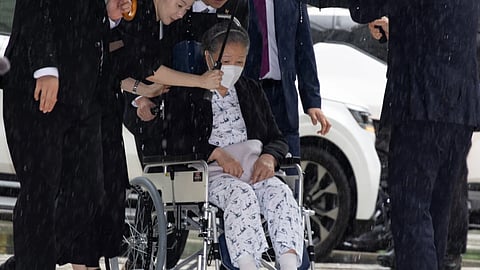 Unification Church leader Hak Ja Han, on the wheelchair, arrives for the sentencing hearing on allegations of bribery and political funding, at the Seoul Central District Court in Seoul, South Korea