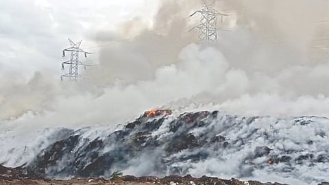 Smoke rising from the fire that broke out at the dumpyard on Saturday