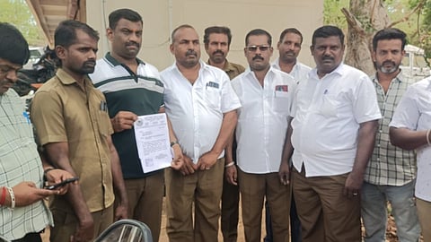 Private tour bus operators at Tiruchy Collectorate on Monday 