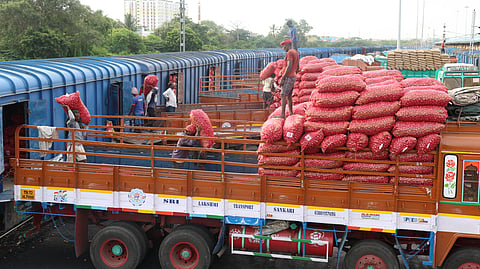 Labourers unloading onion sacks from Kanda Express in Chennai on Tuesday