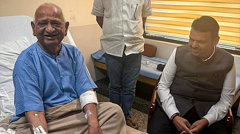  In this image posted on Sept. 1, 2026, Maharashtra Chief Minister Devendra Fadnavis with veteran social worker Anna Hazare at a hospital to inquire about his health, in Mumbai.