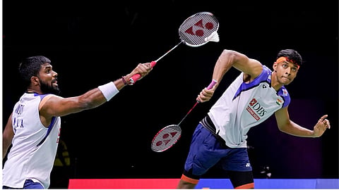 India's Satwiksairaj Rankireddy, left, along with Chirag Shetty compete in the quarterfinal of men's doubles badminton match against China's Liang Weikeng, unseen, and Wang Chang, unseen, during the BWF World Championships, at IGI Stadium, in New Delhi.
